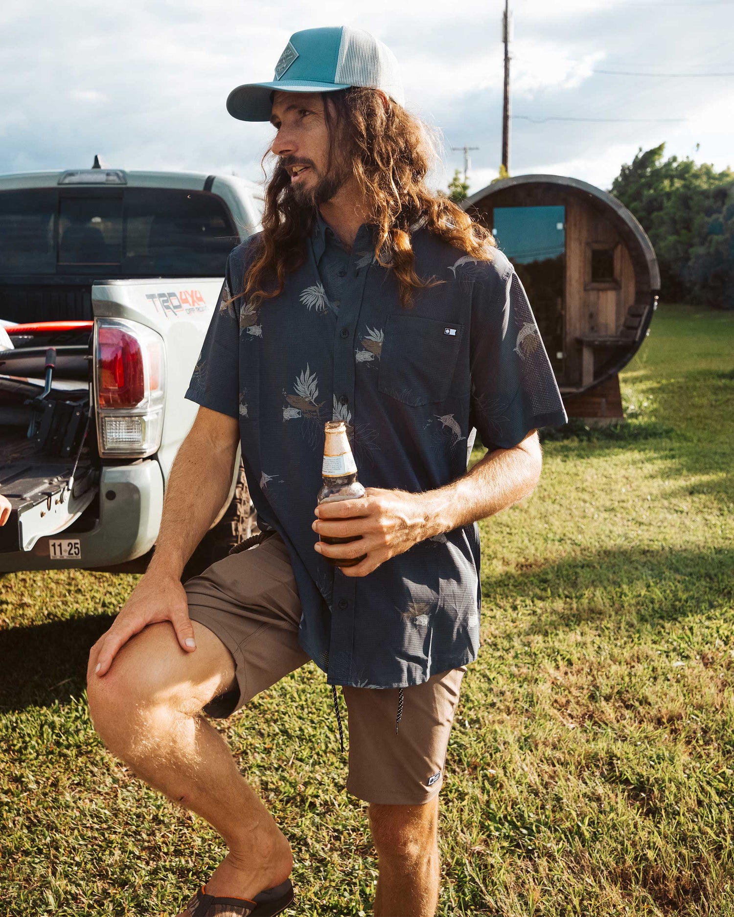 Lifestyle shot of the Breezer Perforated Button Up - Charcoal. 