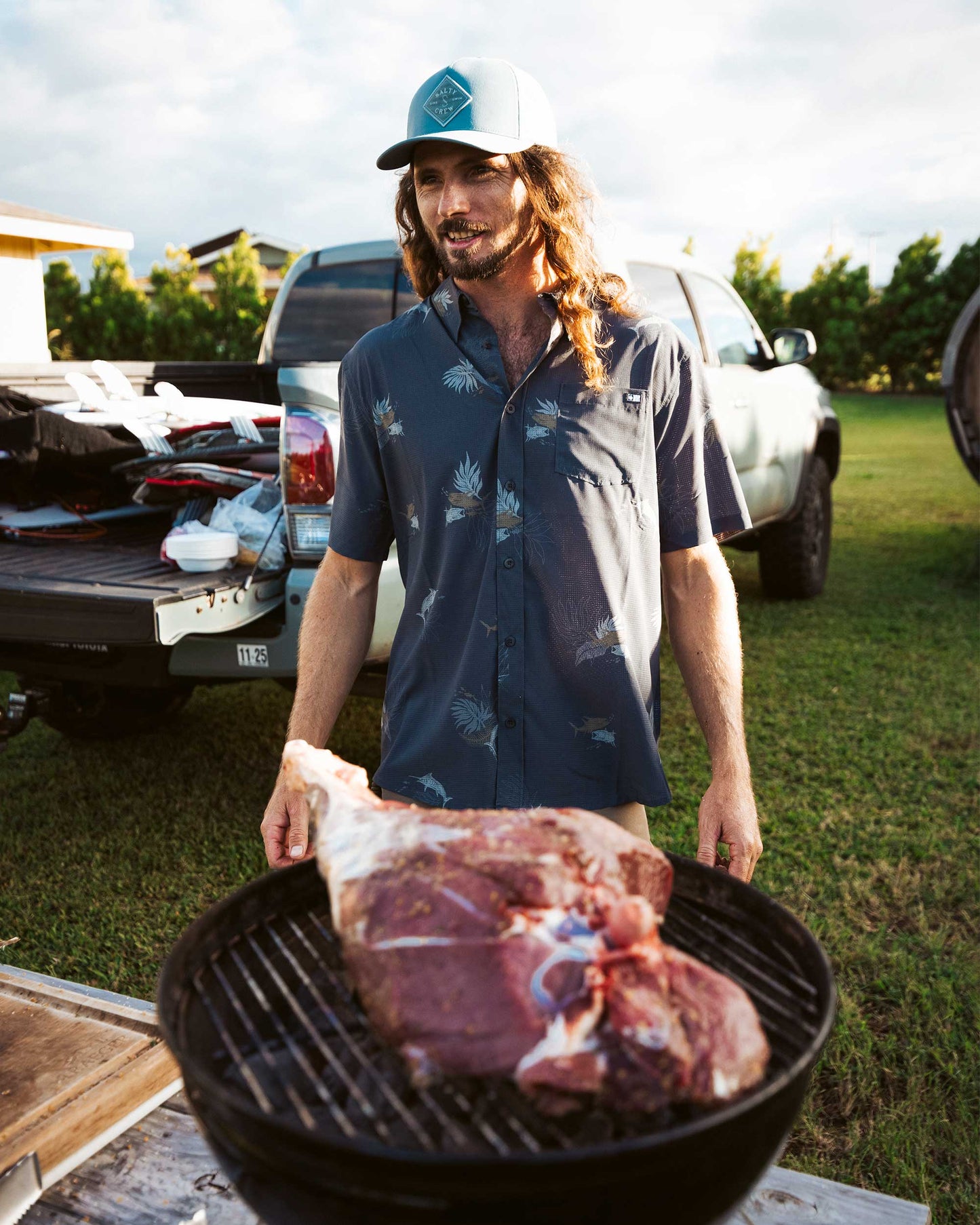 Lifestyle shot of the Breezer Perforated Button Up - Charcoal. 