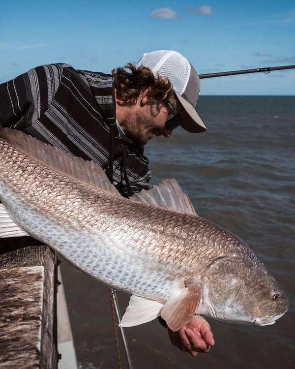 Candid photo of the Crewser Fleece Hood - Black. 