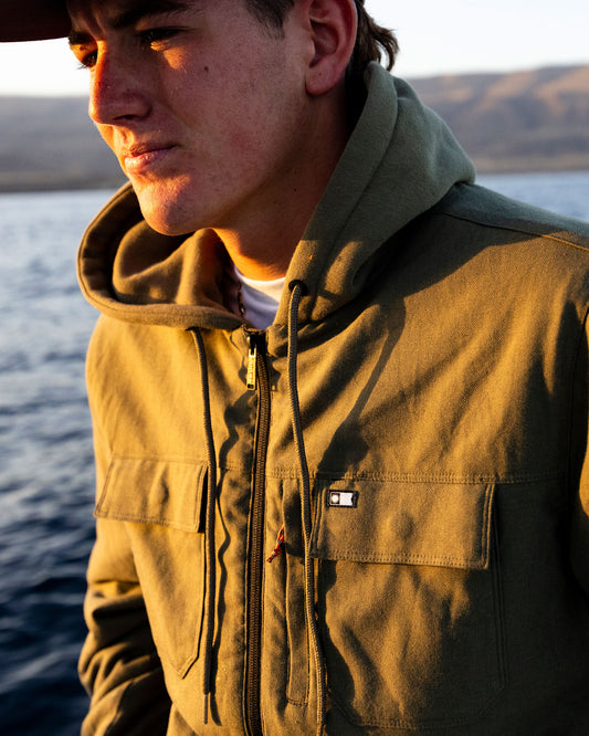 Candid photo of the Fathom Jacket - Olive. 