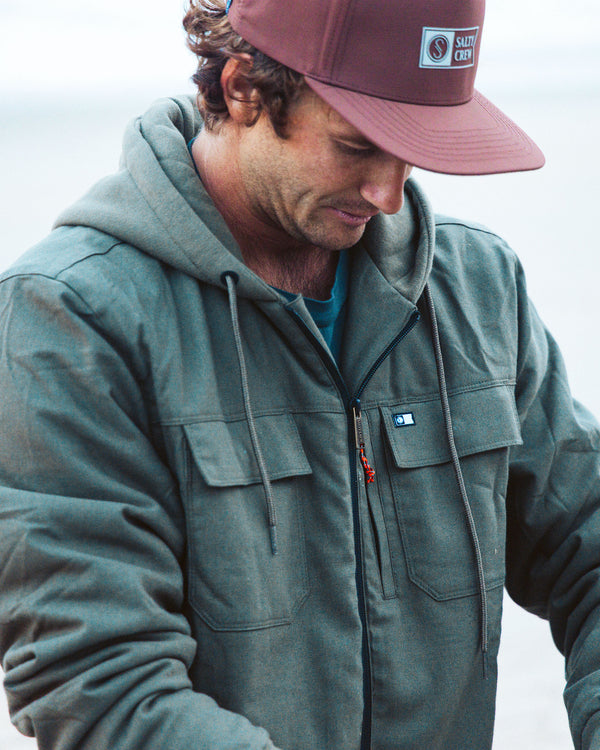 Lifestyle shot of the Fathom Jacket - Olive. 