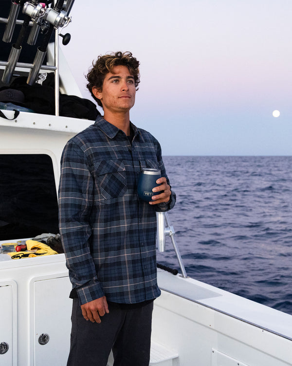 Lifestyle shot of the Fathom Tech Flannel - Navy Khaki. 