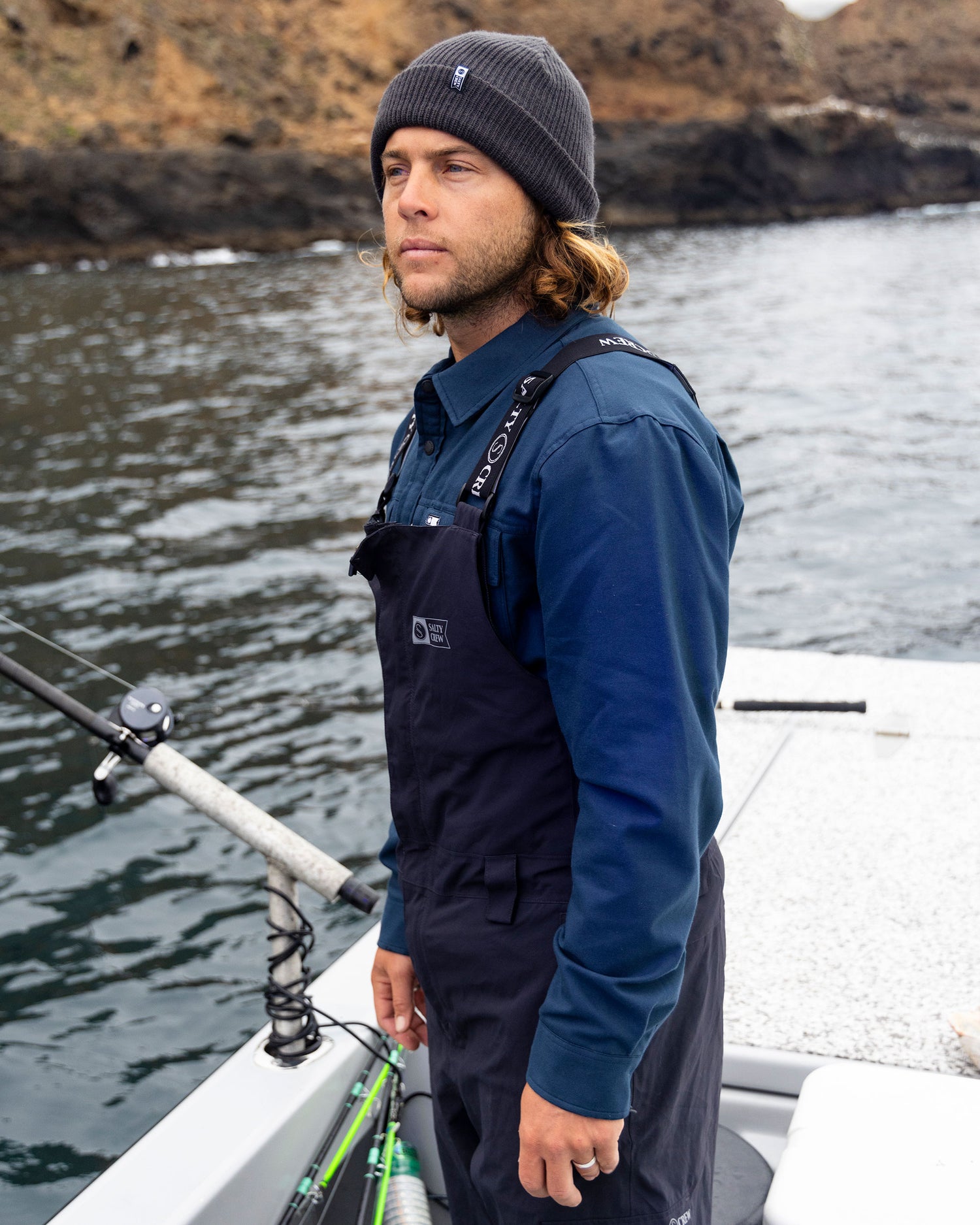 Candid photo of the Fathom Tech Shacket - Midnight Navy. 