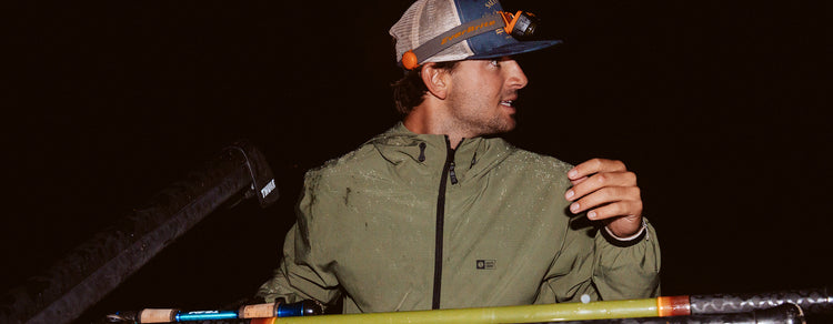 Lifestyle shot of the Stowaway Windbreaker Jacket - Four Leaf Clover. 