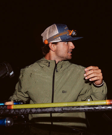 Lifestyle shot of the Stowaway Windbreaker Jacket - Four Leaf Clover. 