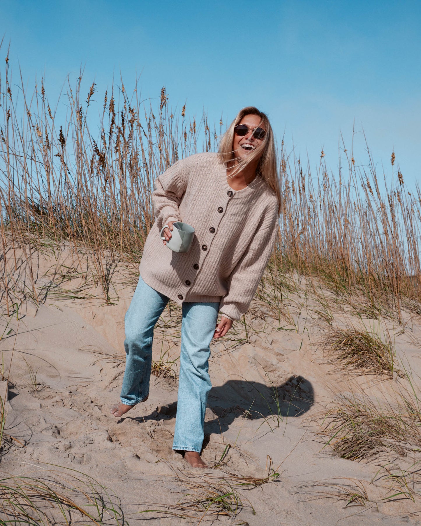 Lifestyle shot of the Mariner Cardigan - Oatmeal. 