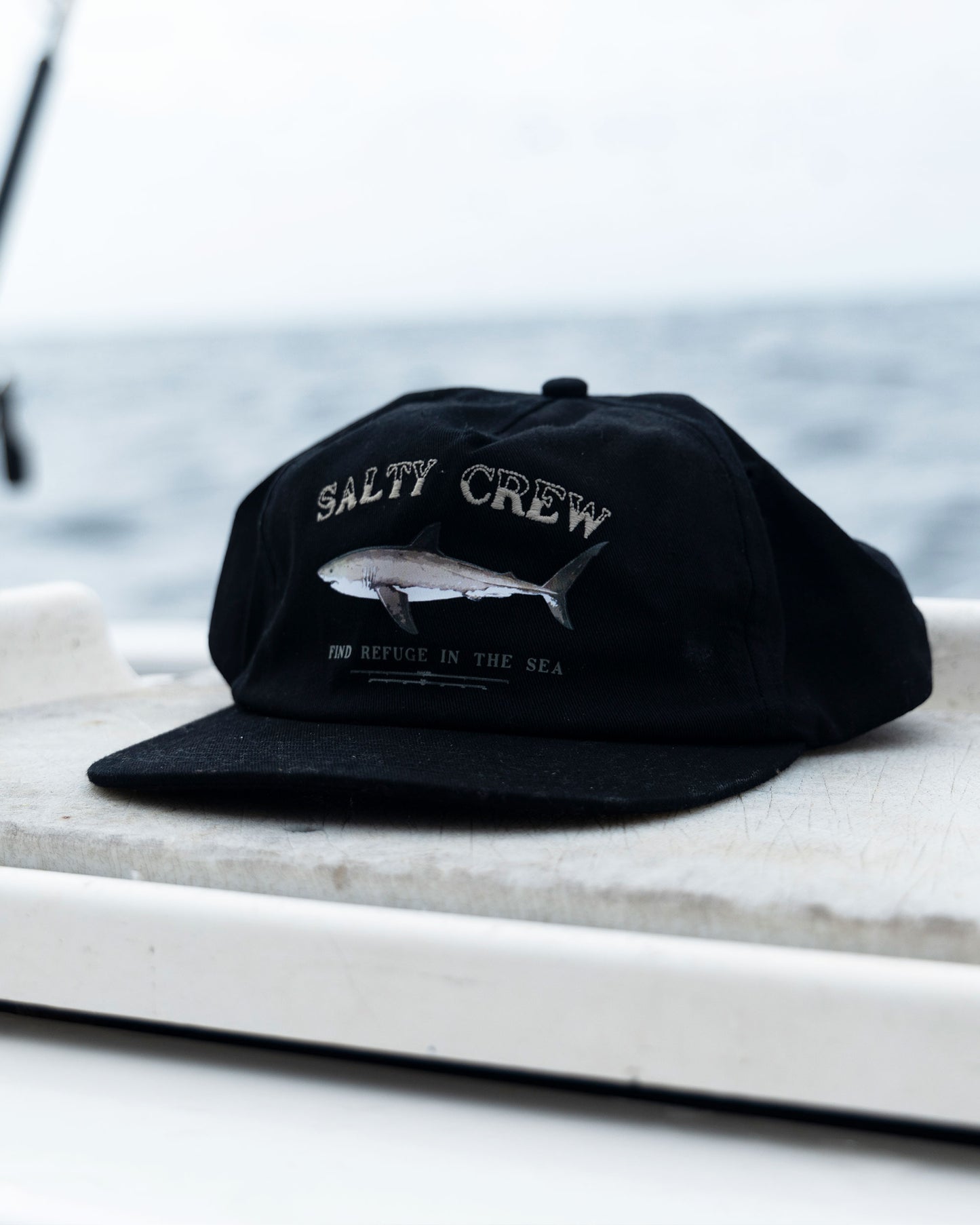 Lifestyle shot of the Seawater Snapback - Black. 
