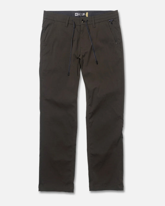 The Salty Crew Transom Tech Pants in Deep Forest feature a straight-leg fit, black drawstring waist, front and back pockets, and 4-way stretch for comfort, shown flat against a white background.
