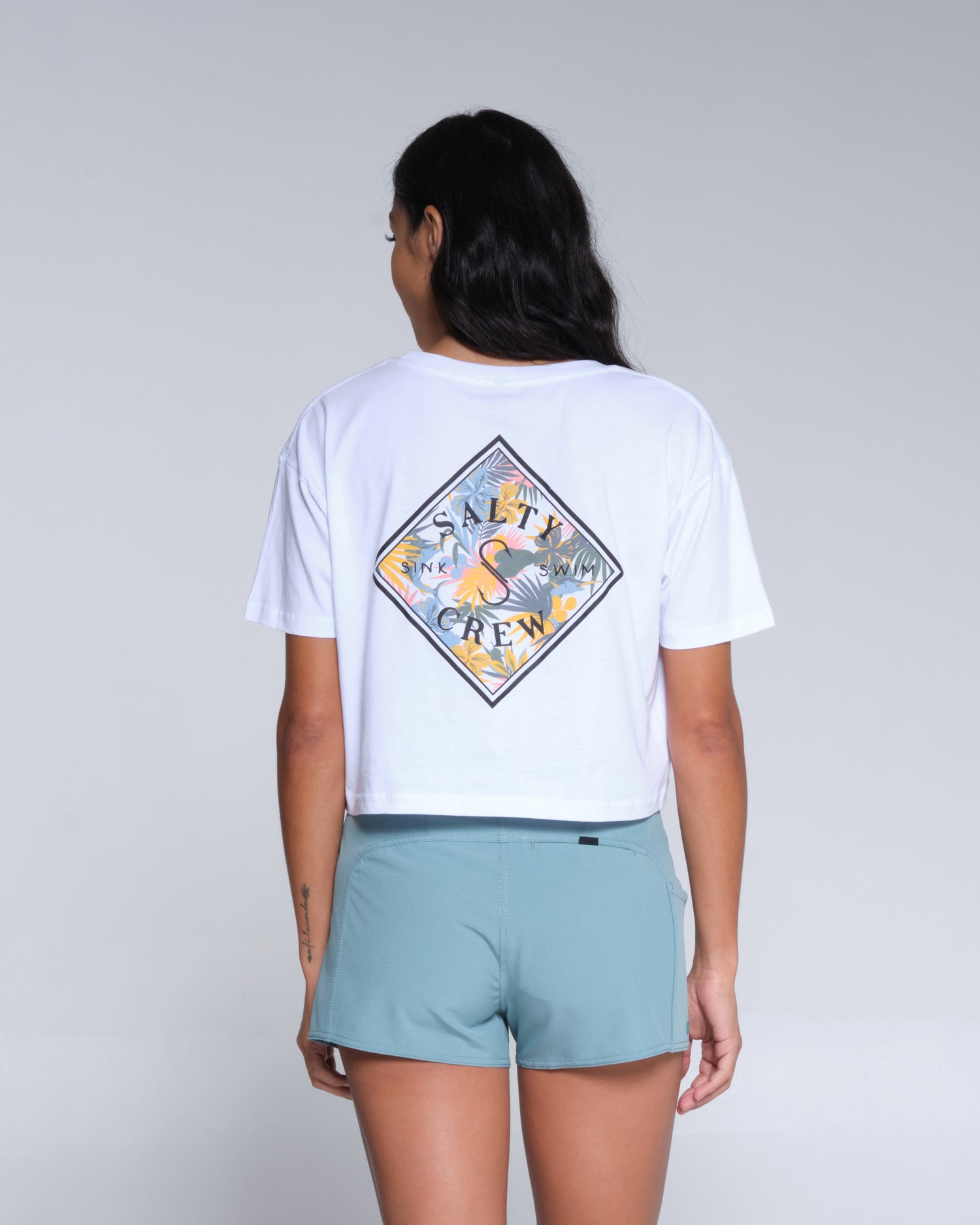 On body back of the Tippet Tropic White Crop Tee
