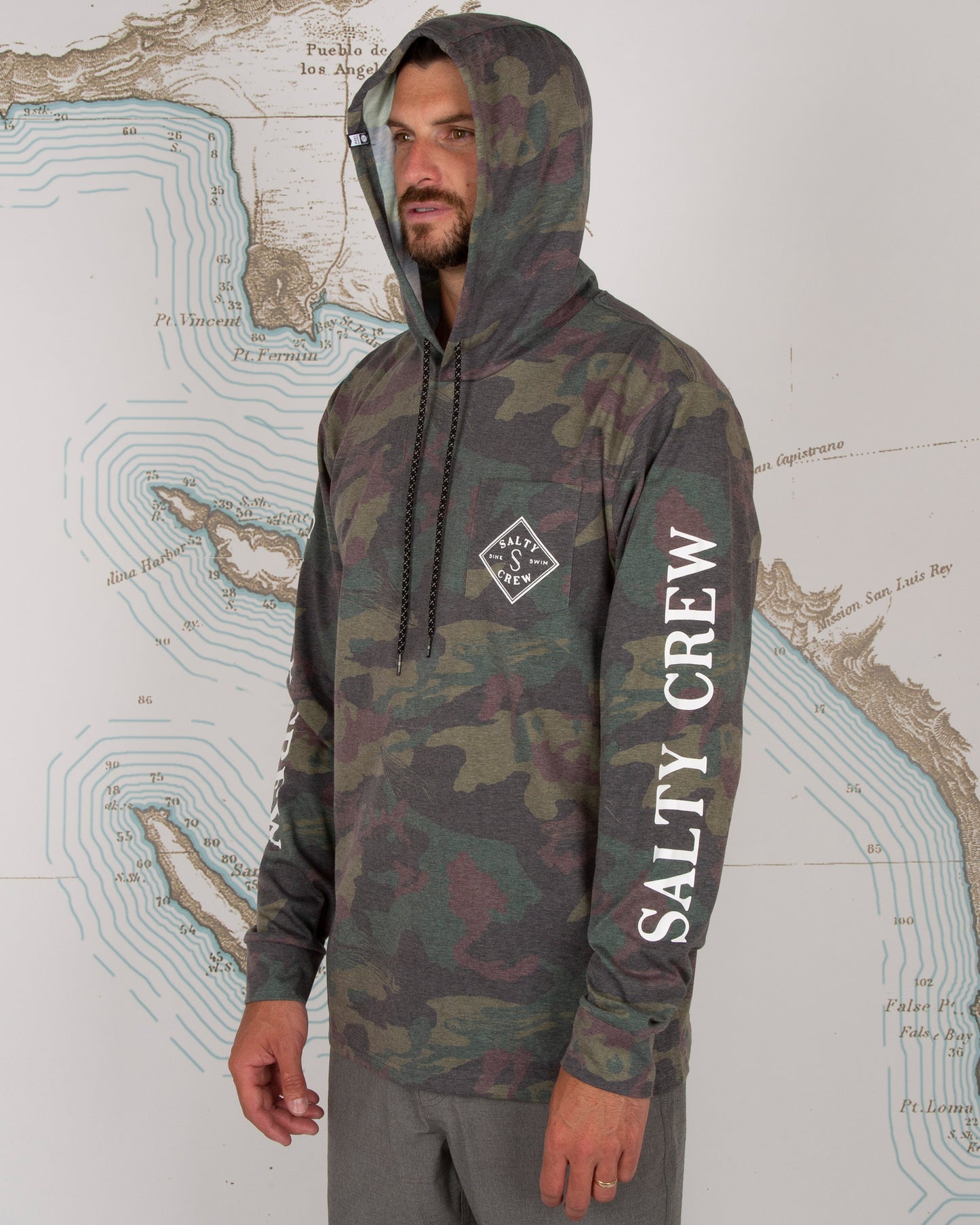 On body front left angled of Tippet Camo Pocket Hood Tech Tee
