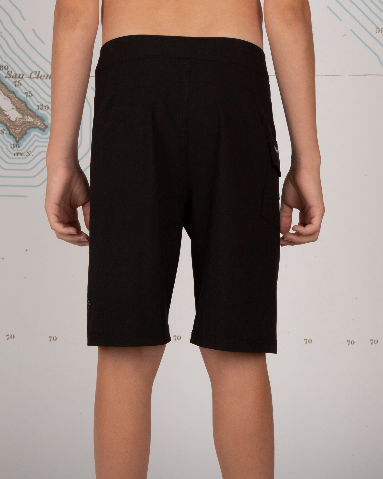 On body back of Lowtide Boys Black Boardshorts