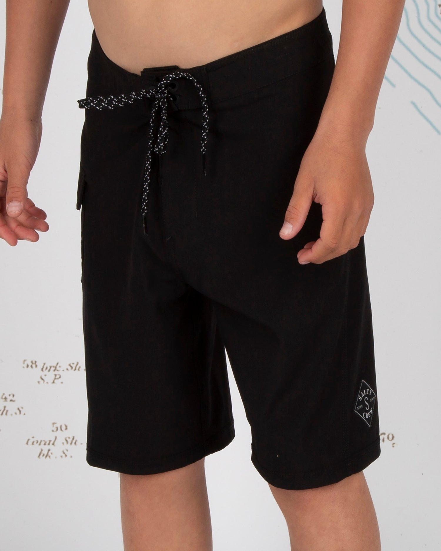 On body front angled of Lowtide Boys Black Boardshorts