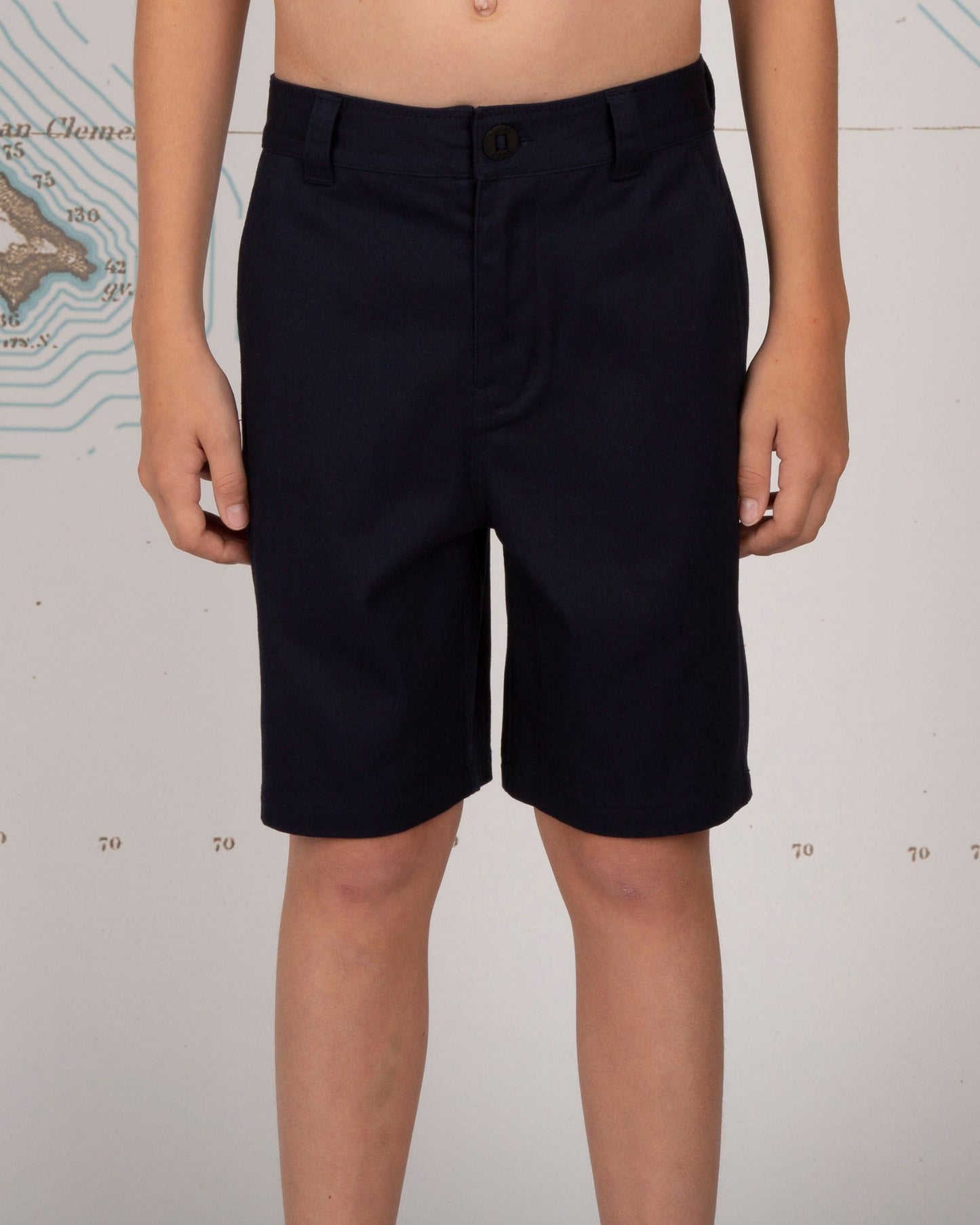 On body front view of the Deckhand Boys Chino Short - Navy. 